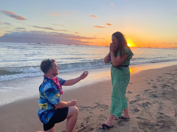 Gareth proposing to Mary on a beach in Hawaii